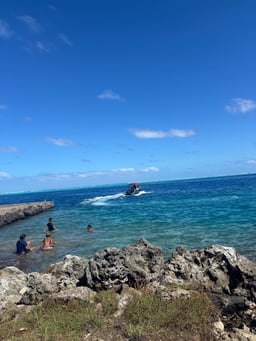 Local kids swimming at the boat ramp