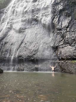 Swimming in a Waterfall Lagoon