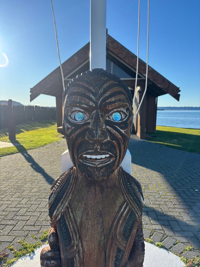 Maori statue with abalone shell eyes