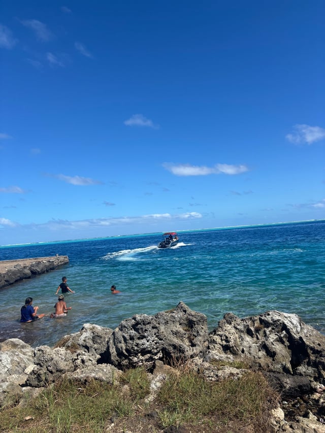 Local kids swimming at the boat ramp — Day 2: Biking around the island